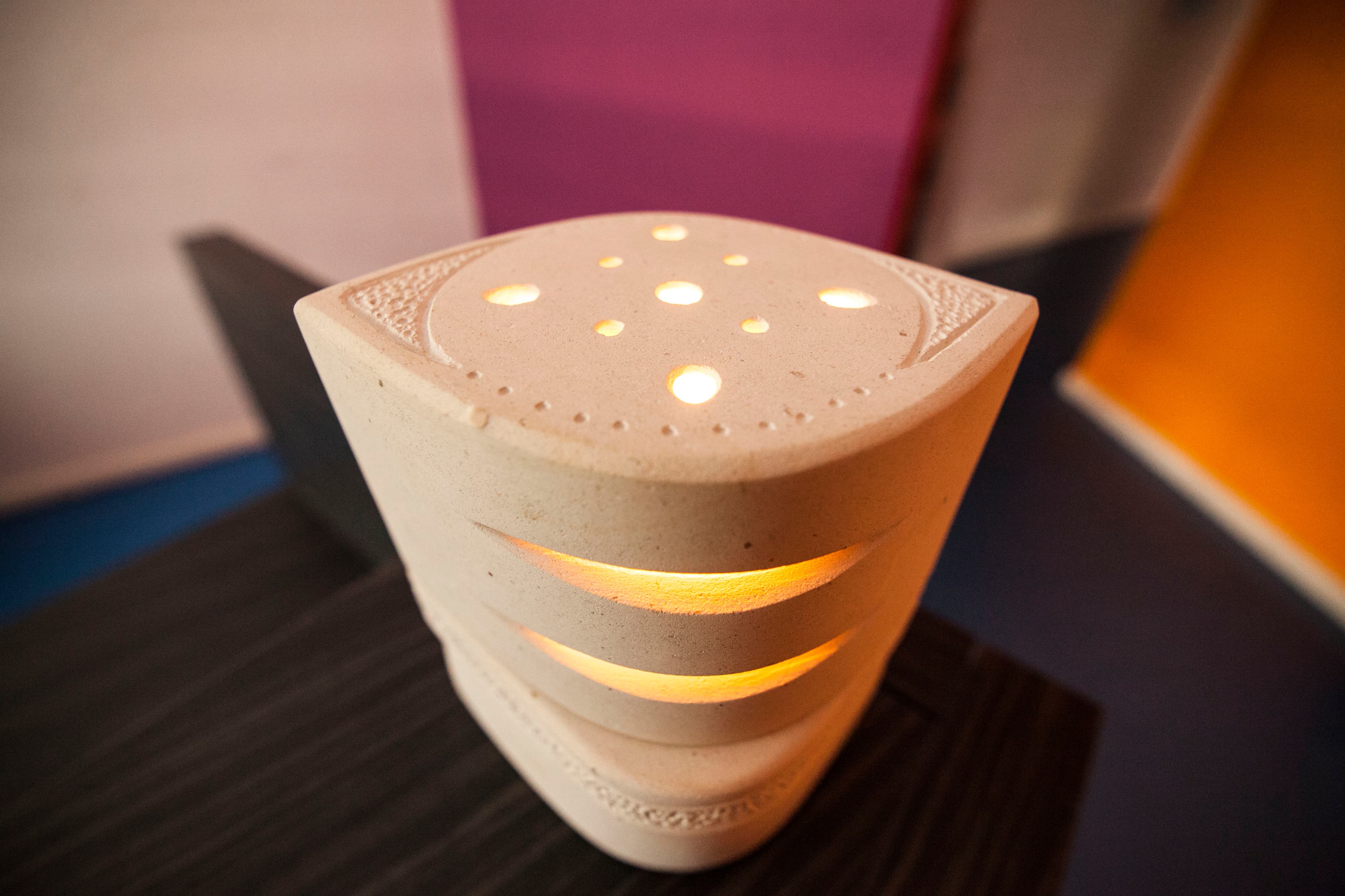 Lampada in pietra rettangolare con fori luminosi, still life South Stones